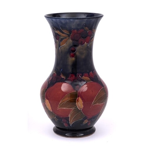 A William Moorcroft vase: of baluster form with waisted neck...