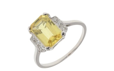 A YELLOW SAPPHIRE AND DIAMOND RING. the cut cornered rectang...