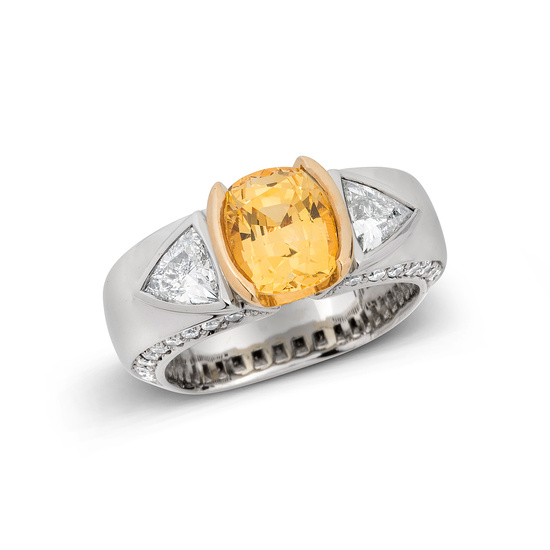 A Yellow Sapphire, Diamond and Gold Ring