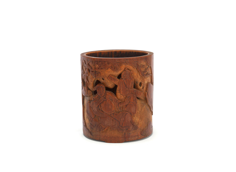 A carved and pierced bamboo brushpot