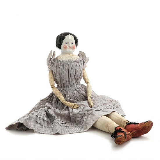 NOT SOLD. A circa 1870 porcelain head doll with cloth body, in original clothing with...