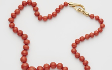 A coral necklace with an 18k gold Pomellato clasp.