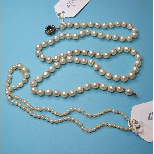 A cultured pearl necklace, and another similar (2)