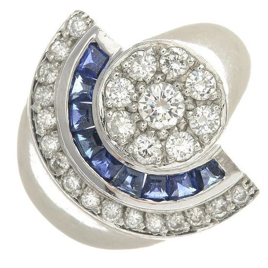 A diamond and sapphire dress ring.Estimated total