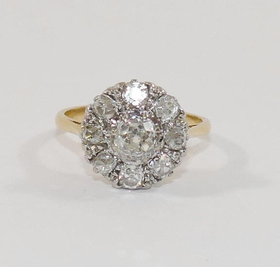 A diamond cluster ring, the centre old cut stone approximate...