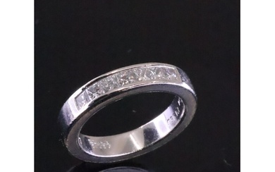 A diamond set half eternity ring with a copy of a valuation ...