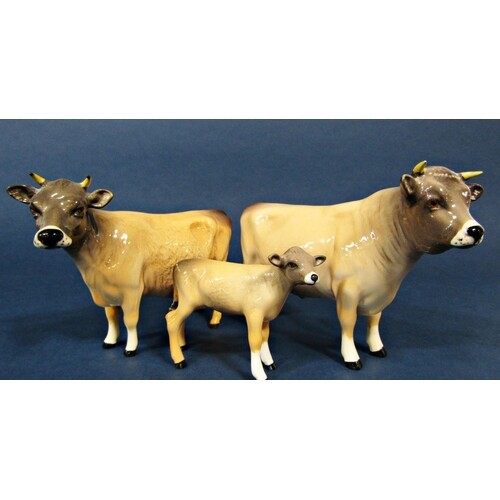 A family of three Beswick Jersey cattle comprising bull, cow...