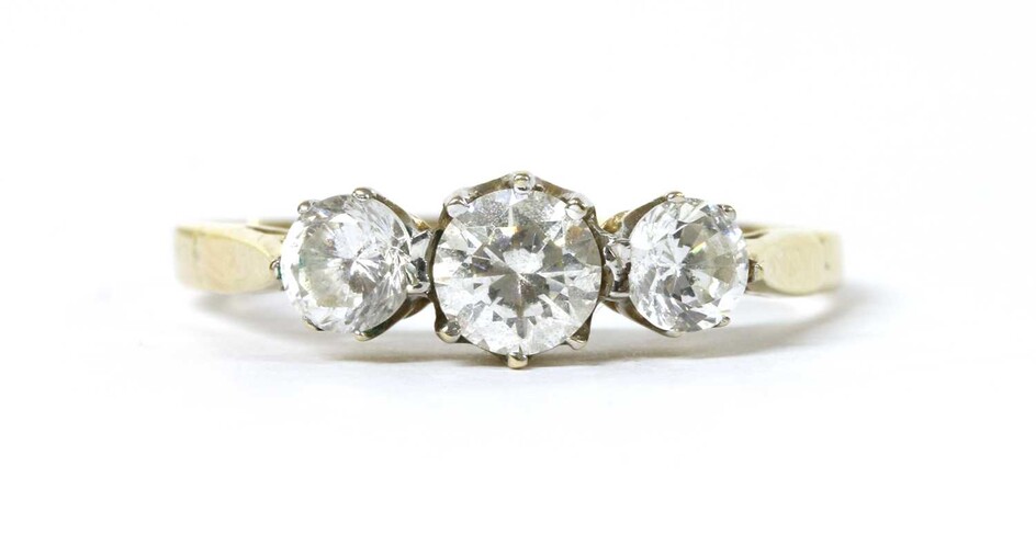 A gold three stone cubic zirconia ring