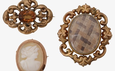 A group of three brooches