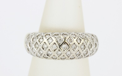 A heavy yellow and white metal (tested minimum 9ct gold) diamond set pave ring, (Q).