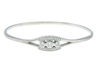 A hinged bangle, with brilliant-cut diamond details.