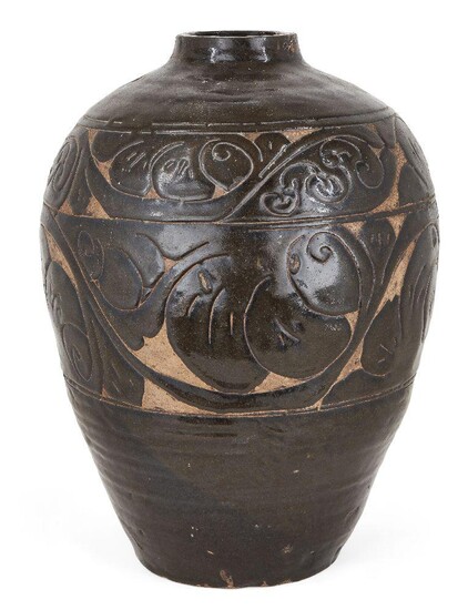 A large Chinese sgraffito brow-glazed Cizhou-type jar, Yuan dynasty, covered in a rich brown glaze carved through to the body with two bands of leafy foliage, 43cm high