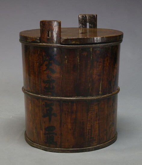 A large Japanese cast iron bound sake...