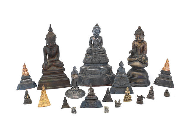 A large group of variously bronze, white metal and yellow metal Buddhist figures and weights