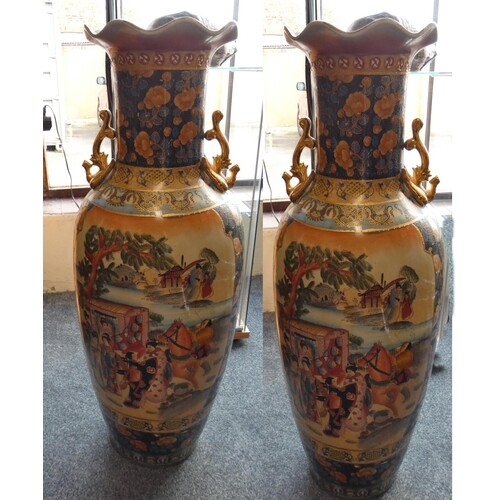 A large pair of chinese floor vases decorated with ladies an...