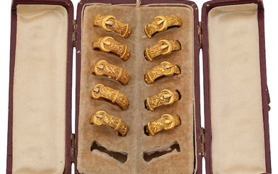 A late Victorian cased jeweller's sample set of 18ct gold cased buckle rings