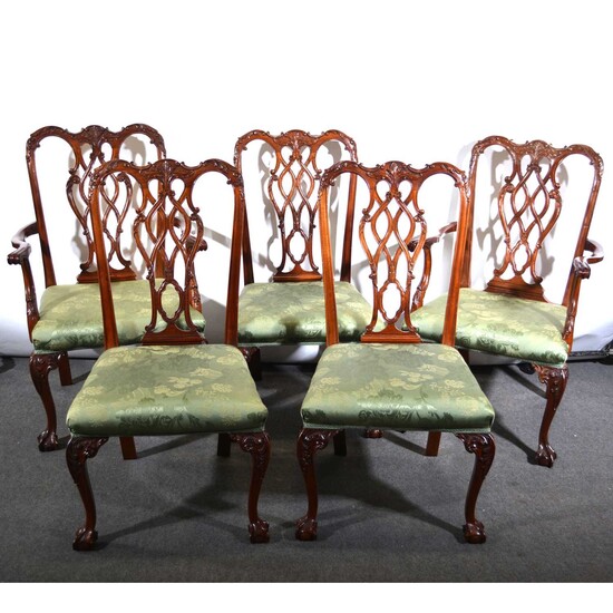 A mahogany dining table and matching set of eight chairs, in the Chippendale style