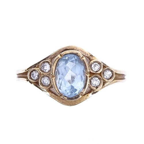 A modern 9ct gold aquamarine and diamond dress ring, setting...
