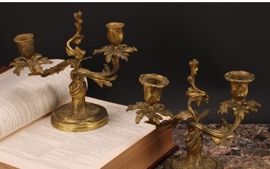 A pair of 19th century gilt brass two-light candelabra, cast...