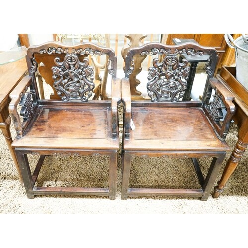 A pair of Chinese carved hongmu elbow chairs (a.f.), width 6...