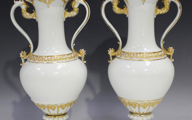 A pair of Meissen porcelain two-handled vases, 20th century, each white glazed body with palmette an