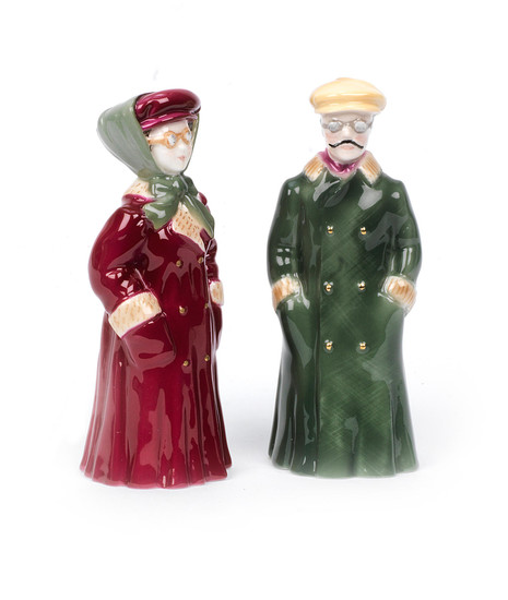 A pair of glazed ceramic 'The Motorist' candle snuffers by Royal Worcester