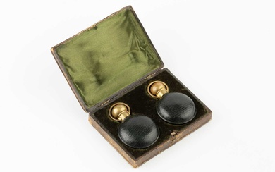 A pair of late Victorian green leather cased scent bottles,...