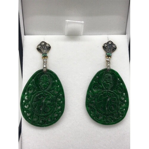 A pair of oval shaped patterned dyed jade drop earrings set ...