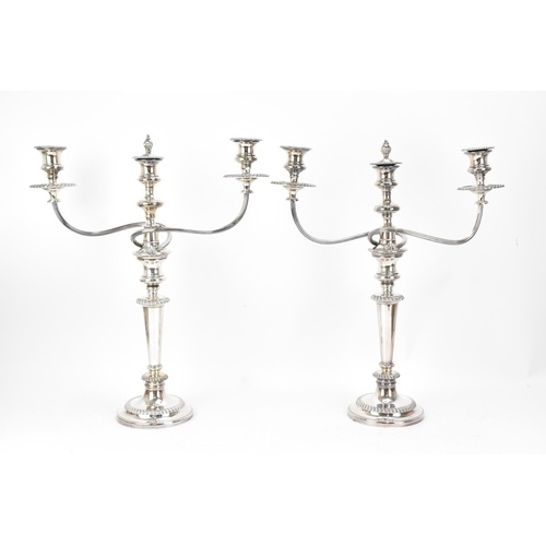 A pair of silver-plated Adam style candelabra, with twin-arm...