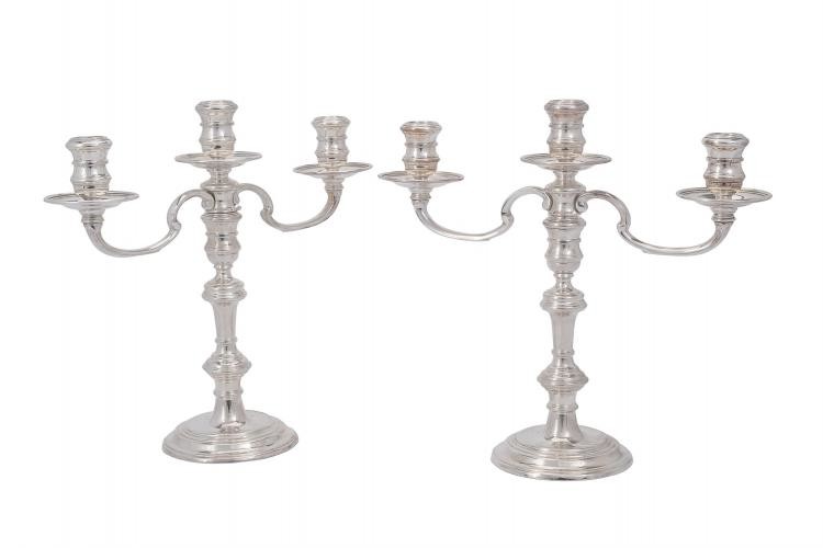 A pair of silver twin branch circular candelabra by Richard Comyns