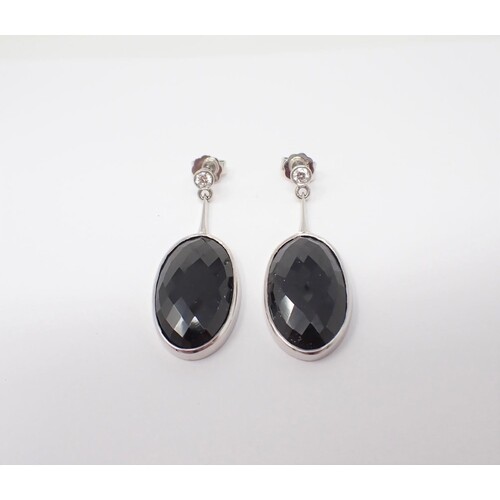 A pair of unheated Sapphire and Diamond Ear Pendants each ru...