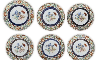 A set of six Chinese famille rose export 'butterfly' plates, 18th century, each enamelled to the centre with a butterfly above blossoming flowers, the rim with iron red and famille rose festoons, comprising five small plates, 23cm diam., and one...