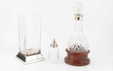 A silver mounted cut glass decanter and stopper, with rounded...