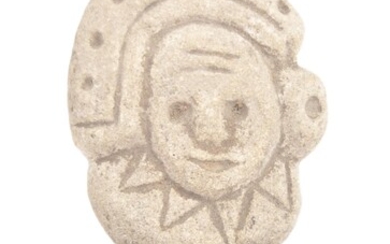 A stone carved Mexican head. Believed to be pre Columbian in period. Naively carved features, of circular form stone, mounted on later base. Approximately 10cm tall.
