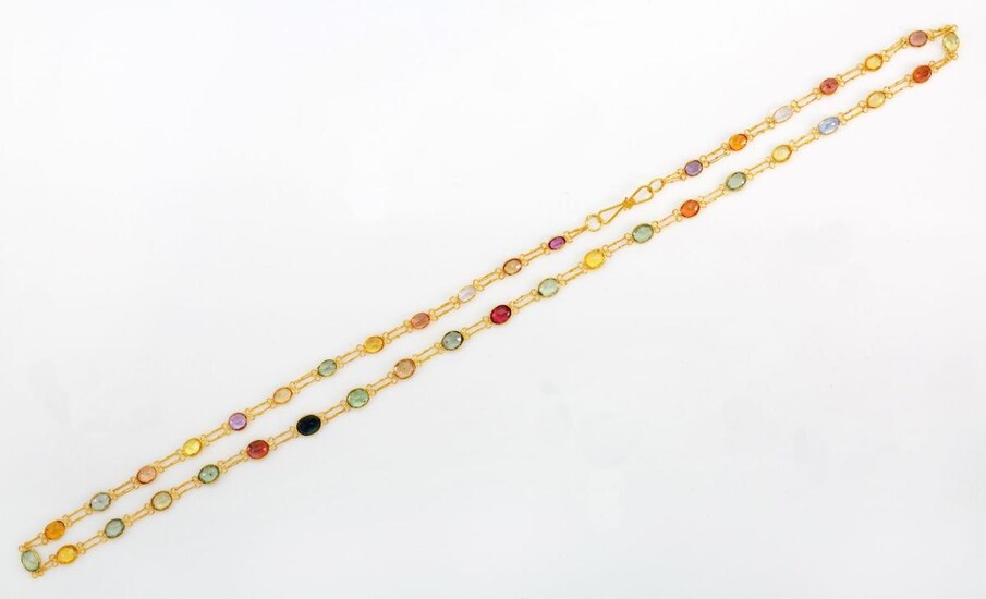 A vari-coloured sapphire necklace, composed of a single line of vari-coloured sapphires in collet mounts with twin fancy-link connections, length 46cm
