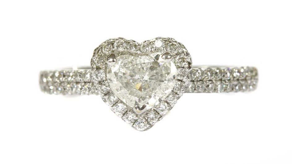 A white gold heart cut diamond halo cluster ring