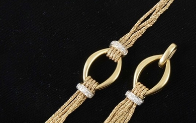 An 18 carat yellow gold and diamond bracelet with matching pendant