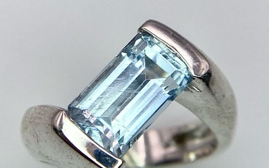 An 18K White Gold Aquamarine Twist Ring. Size L....