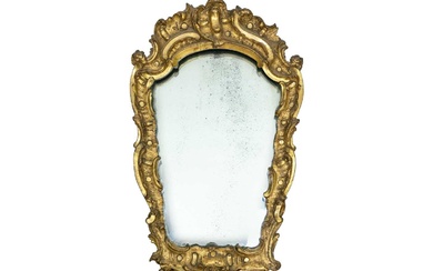 An 18th century baroque wood carved gesso gilt mirror.