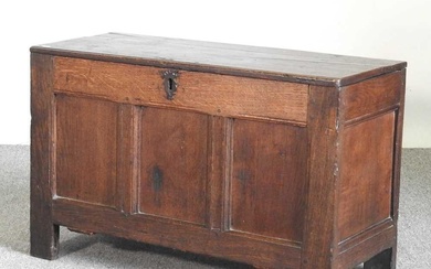 An 18th century oak coffer, with a hinged lid 93w...