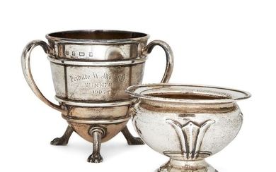 An Edwardian military interest three-handled silver presentation cup, Birmingham, c.1903, Hukin & Heath, engraved with the Honourable Artillery Company crest and raised on three stylised paw feet, together with an Edwardian silver pedestal bowl...
