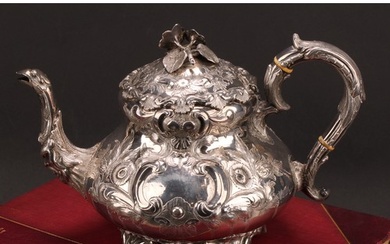 An Irish Victorian Rococo Revival silver melon shaped teapot...