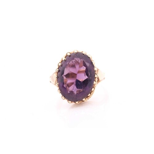 An amethyst dress ring, set with an oval amethyst measuring ...