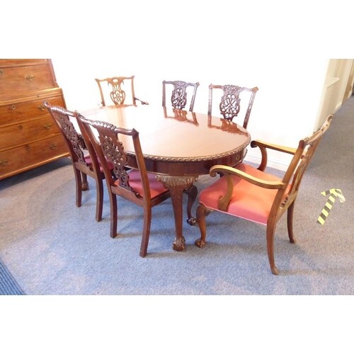 An early 20th century extending oval mahogany dining table h...