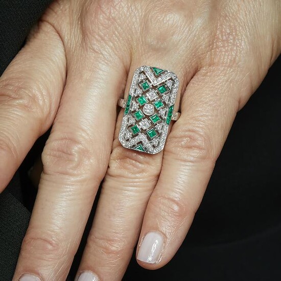 An emerald, diamond and 18K white gold ring. Gross