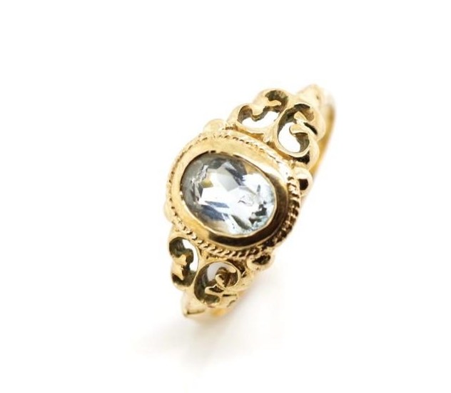 Aquamarine and 9ct yellow gold ring with scroll work shoulde...