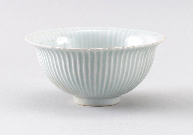 CHINESE CELADON PORCELAIN PERSIMMON BOWL With flared rim and gently ribbed sides. Height 3". Diameter 5.5".