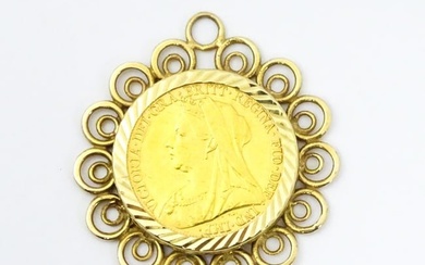 Coin A Victoria 1897 gold sovereign, Melbourne Mint, mounted within a 9ct gold captive pendant