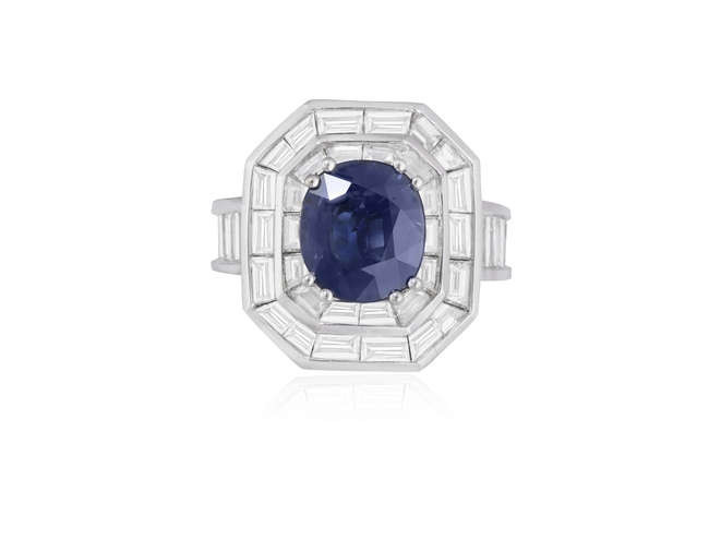 Description A SAPPHIRE AND DIAMOND COCKTAIL RING The cushion-shaped...