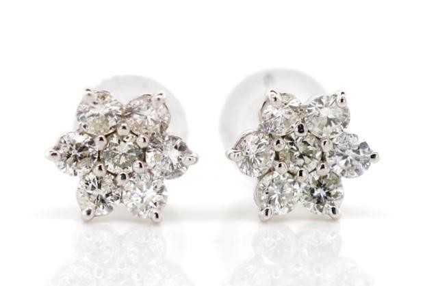 Diamond cluster set 18ct white gold stud earrings. Set with ...
